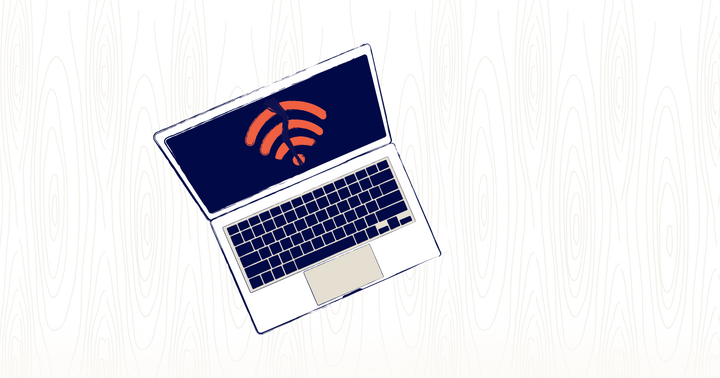 a laptop sits open on a desk. On the screen is a wifi icon, broken in half.